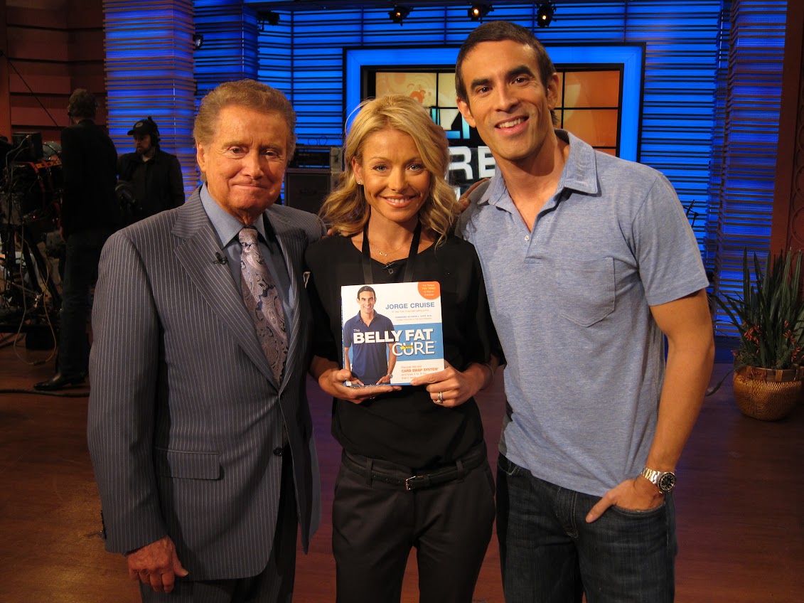 Jorge Cruise with Regis Philbin and Kelly Ripa on the Live set, Kelly holding The Belly Fat Cure