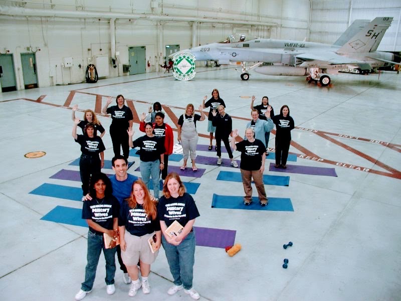 Jorge Cruise with military wives in front of an F/A-18 at MCAS Miramar for Good Morning America