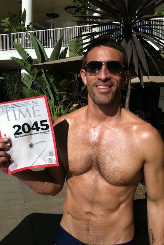 Jorge Cruise at 39, poolside at the Beverly Wilshire in 2011, holding TIME's cover "2045: The Year Man Becomes Immortal"